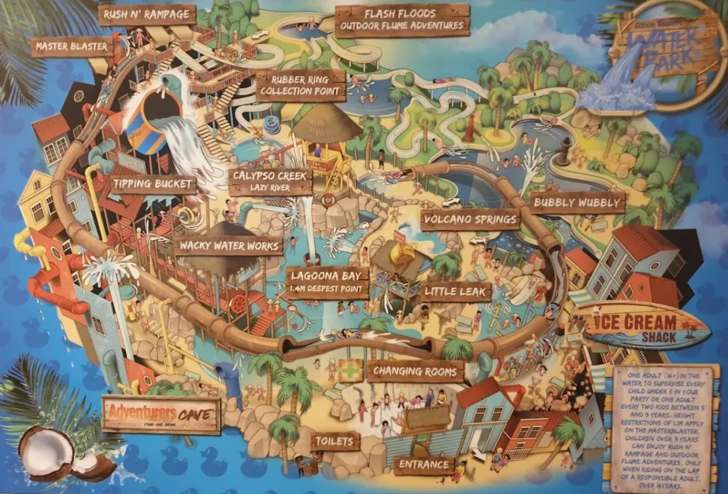 Cartoon-style map of Alton Towers Water Park in Staffordshire, showing key attractions including Master Blaster water coaster, Rush ’n’ Rampage flumes, Flash Floods outdoor slides, Tipping Bucket, Wacky Waterworks play zone, Calypso Creek lazy river, Lagoona Bay pool, Little Leak toddler area, Bubbly Wubbly outdoor pool, and food outlets like Adventurers Cave and Ice Cream Shack.