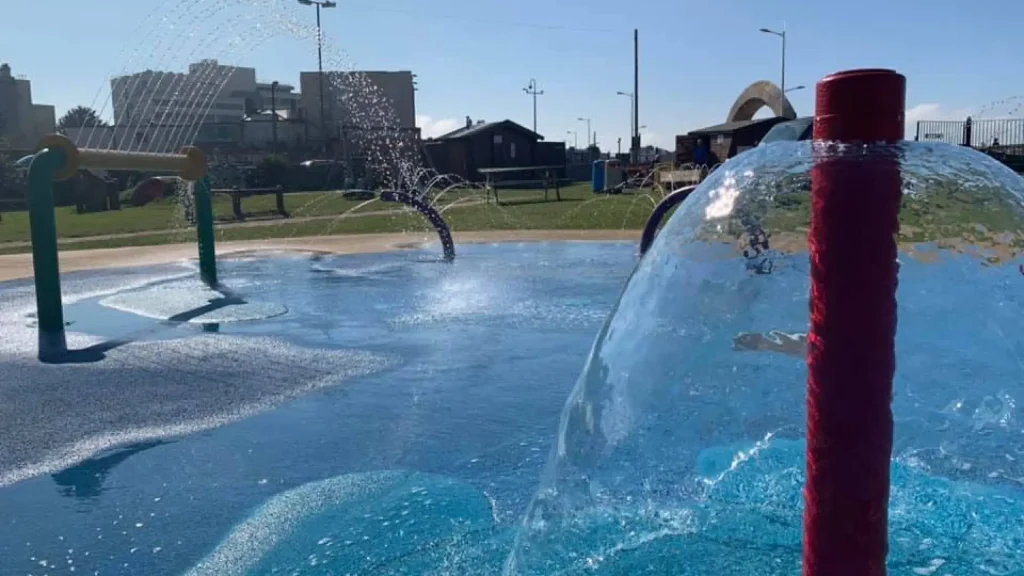 Close-up of water features at the splash pad in Water Adventure Play Park, Weston-super-Mare, with spray tunnels and bubbling fountains.