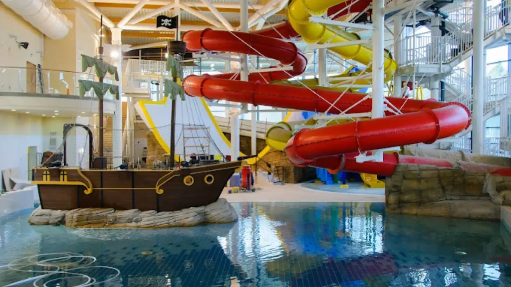 Pirate ship play structure and colourful spiral water slides in the Leisure Waters area at Bangor Aurora Leisure Centre.