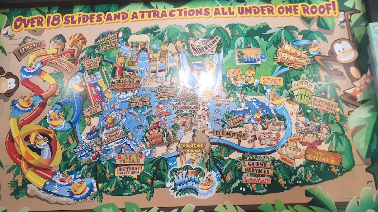 Colourful cartoon-style map of Sandcastle Waterpark Blackpool highlighting slides, pools, and themed zones under one tropical roof.