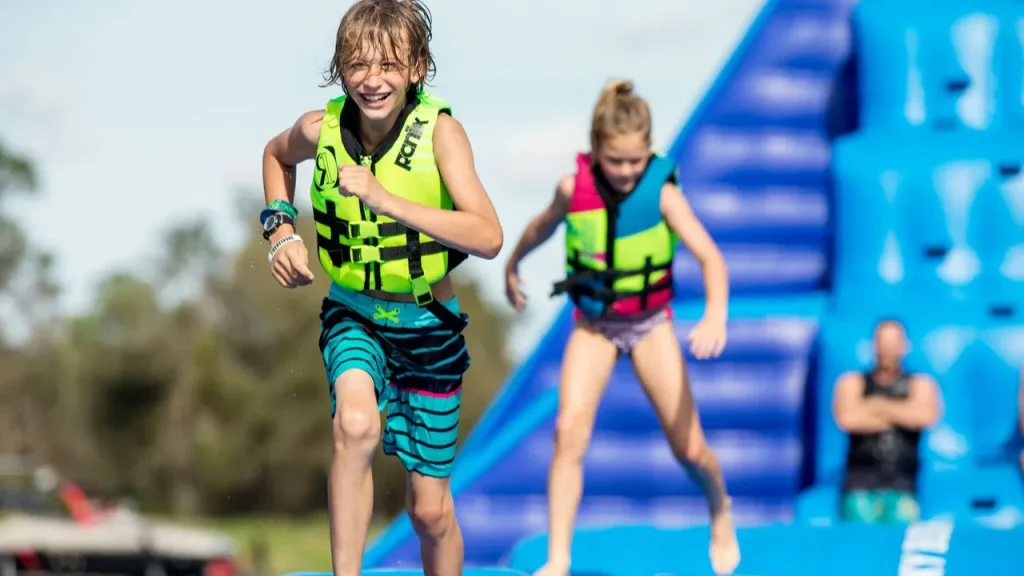 Sblash Aqua Park welcome area with safety gear including red life jackets outside the entrance cabin.