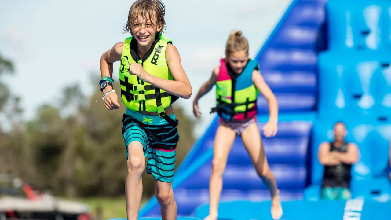 Sblash Aqua Park welcome area with safety gear including red life jackets outside the entrance cabin.
