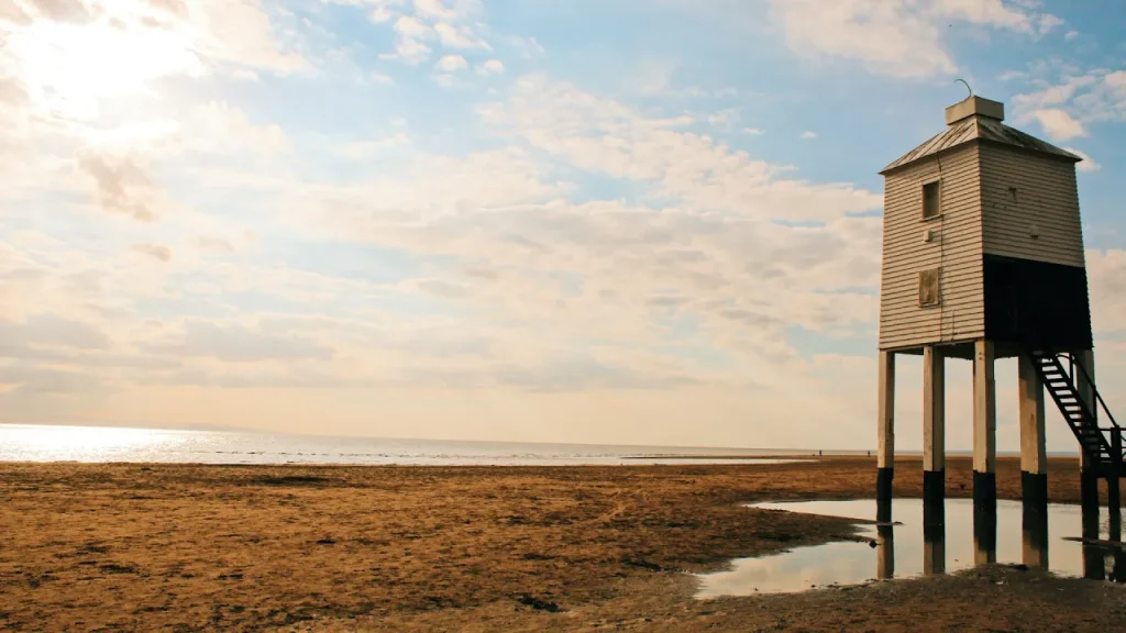 The iconic low lighthouse on Burnham-on-Sea beach—a tranquil spot just minutes from Brean Leisure Park and perfect for seaside walks.