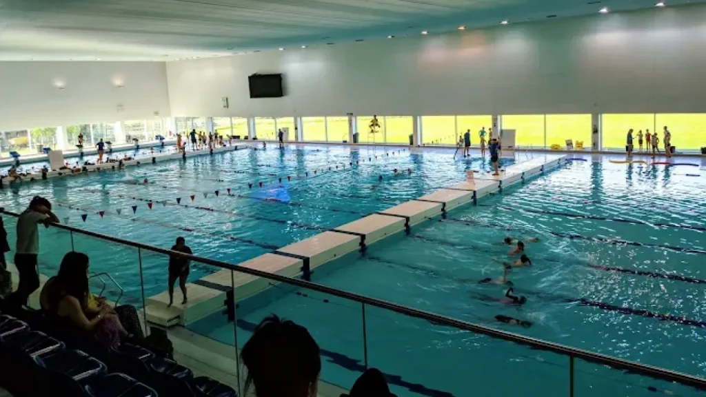People swimming in Hengrove Park Leisure Centre’s Olympic pool during public lane swim.