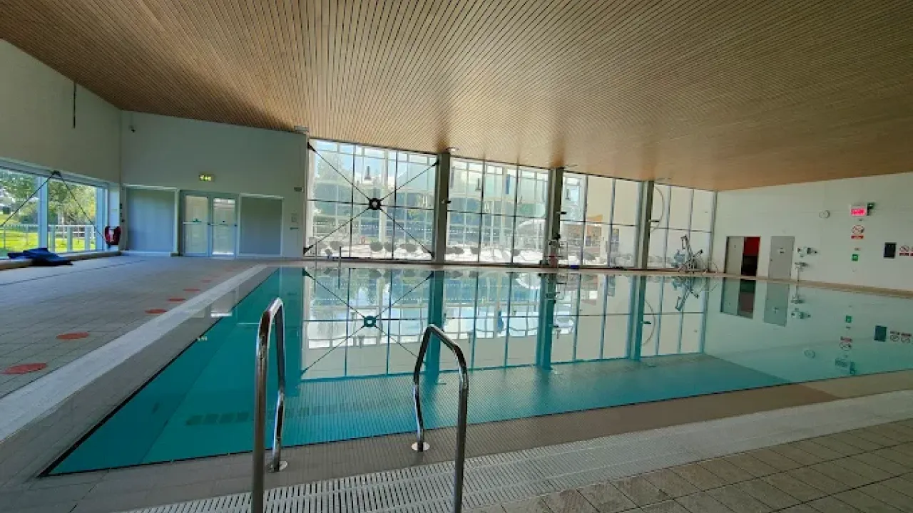 Quiet learner pool at Hengrove Park Leisure Centre with full glass wall and calm lighting.