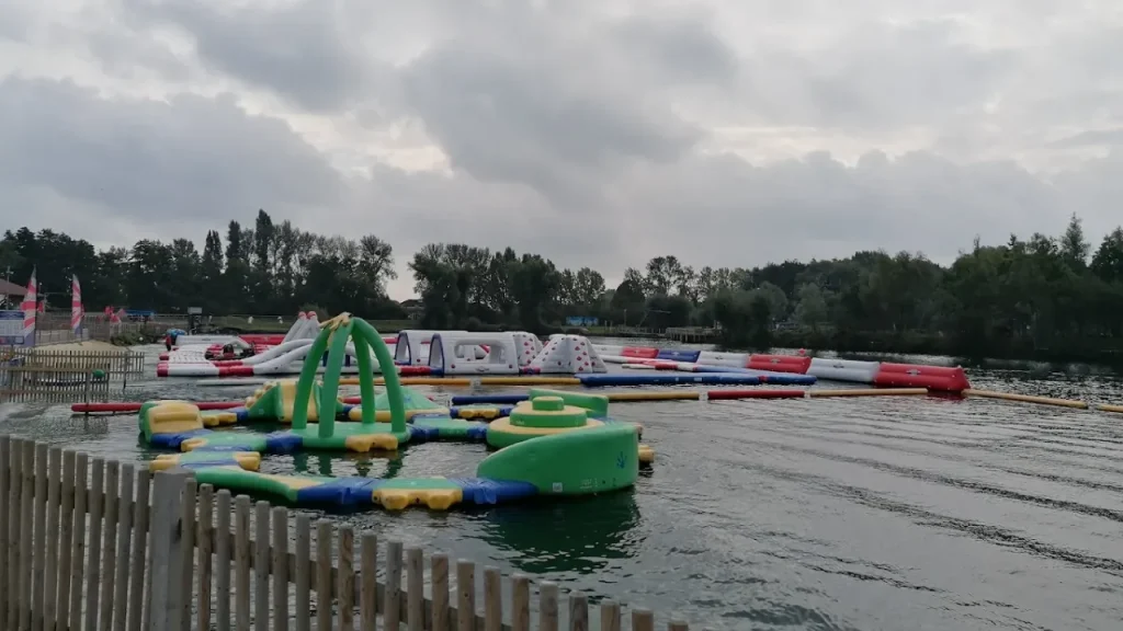 Various inflatable water challenges floating on the lake at Liquid Leisure Aqua Park.
