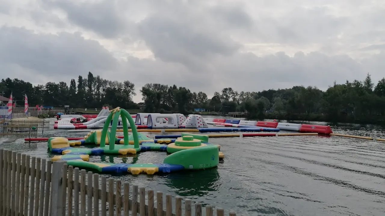 Various inflatable water challenges floating on the lake at Liquid Leisure Aqua Park.